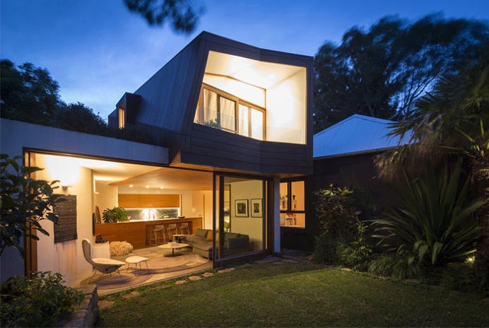 Cottage With a Series of Indoor and Outdoor Spaces