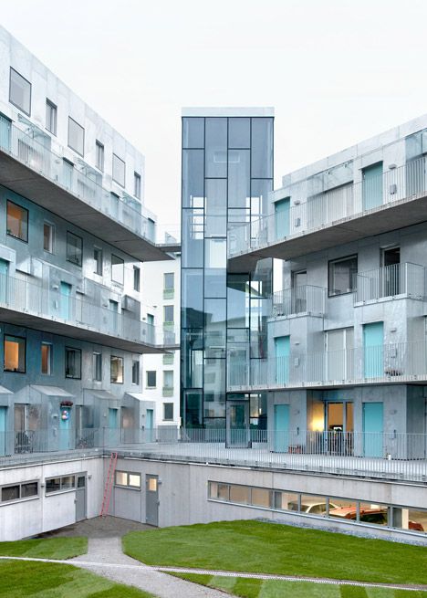 Metal-clad housing by Joliark features boxy balconies