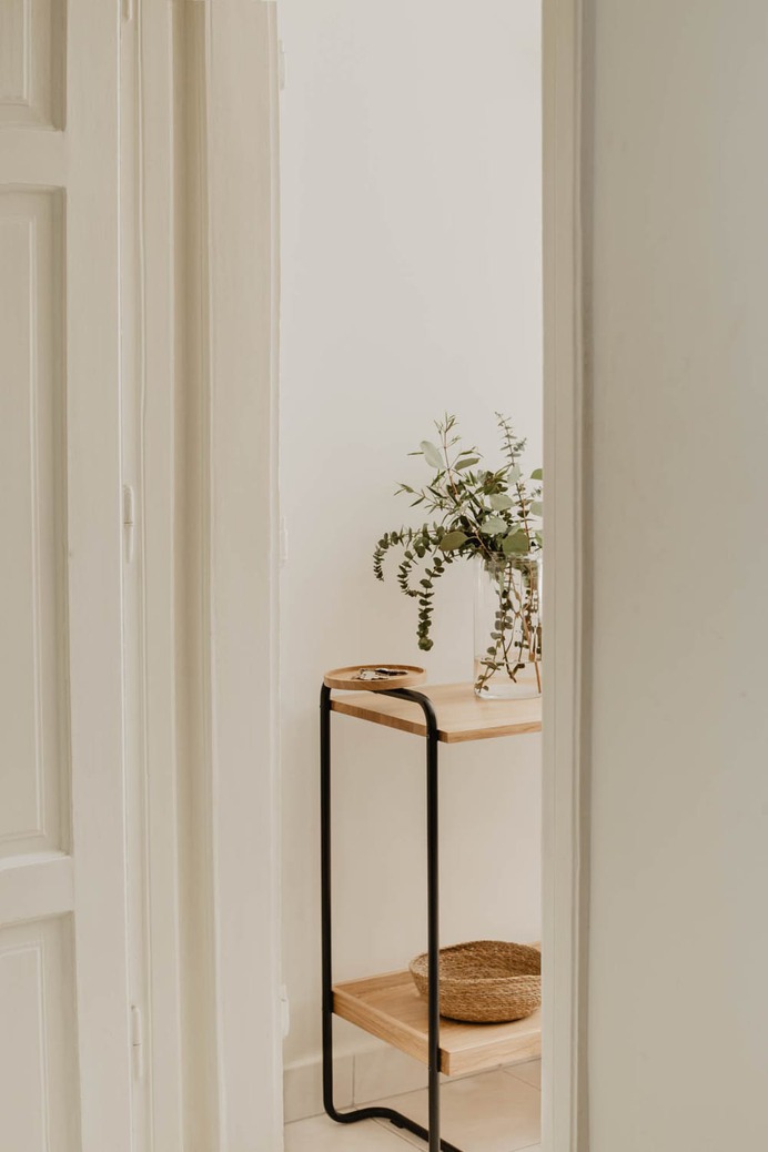 Shelf with vase and keys visible on top