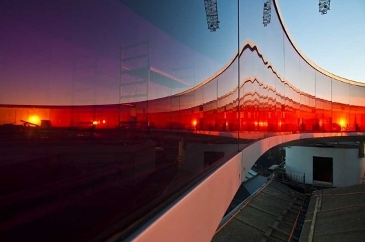 Enlightenment is neither a goal nor a destination. It's a process of awakening to one's inner light. — Synaptic Stimuli #glass #sunset #buildings