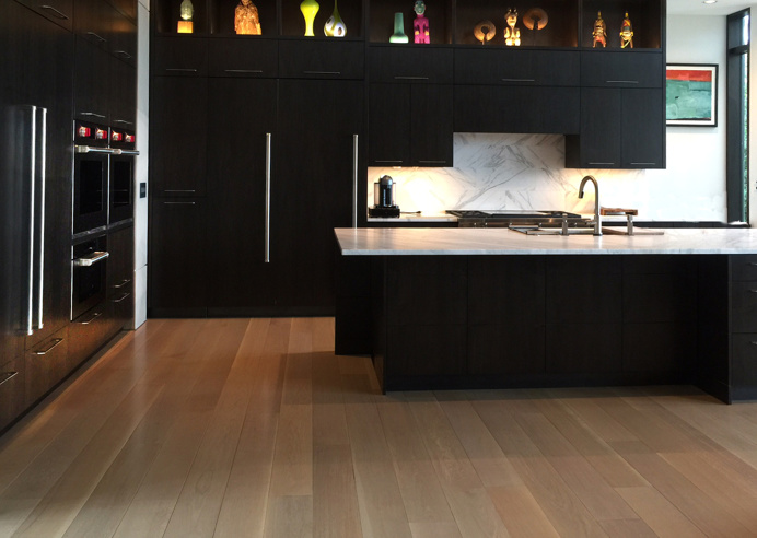 This Bainbridge Island waterfront home has 8" engineered select rift and quarter-sawn white oak plank floors. Shop reactive and oil stains w