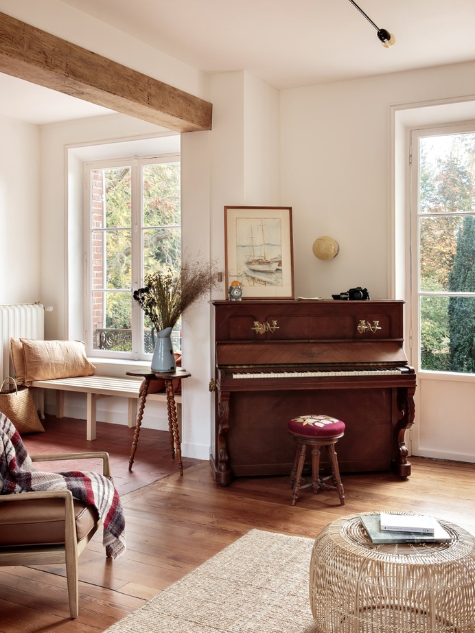 The house had been last occupied in the 1970s and was left furnished. Feilders kept the best pieces, including this piano, a 130-year-old Gabriel Gavreau ("it's newly tuned; we're waiting for Elton John to stop by"), and mixed the antiques with pale modernist designs.