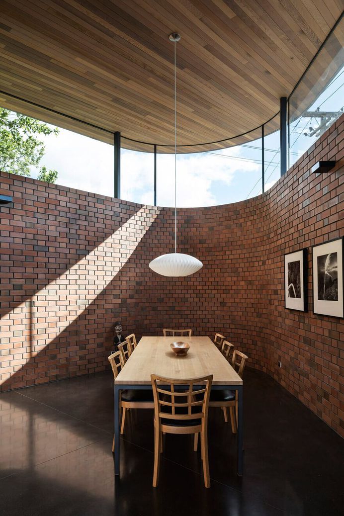 Walled Courtyard House Organised Around a Central Pool 7