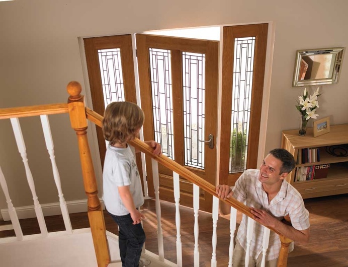Panelled wooden door with two long glass panels, leaded glass and sidelights #entrance #doorway #leaded #glass #panelled #sidelights