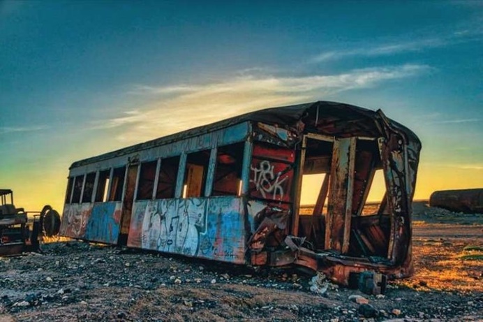Chris Staring Captured Stunnung Cemetery of Abandoned Trains in Bolivia