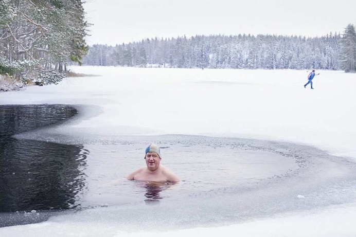 Winter Swimming in The Frozen Lake by Markku Lahdesmaki