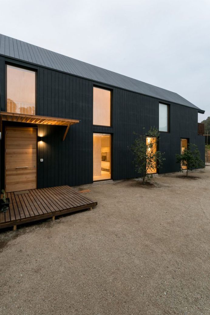 Alejandro Soffia slots two homes inside one long black building in Chile