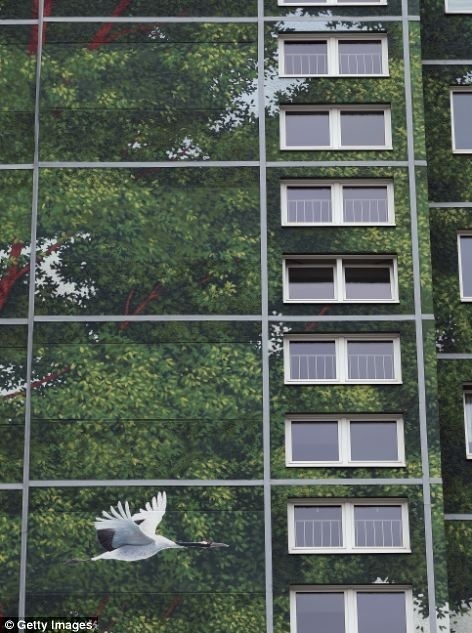 This Could Be The World's Largest Mural | Hi Fructose Magazine #crane #trees #mural