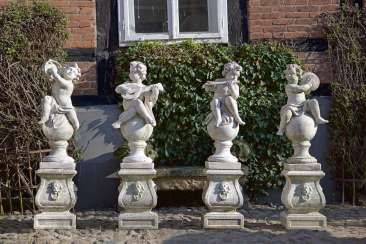 Four putti sculptures as the musicians