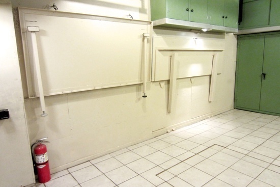 Two work benches on the parking side of the garage fold up against the wall when they're not in use. #bench