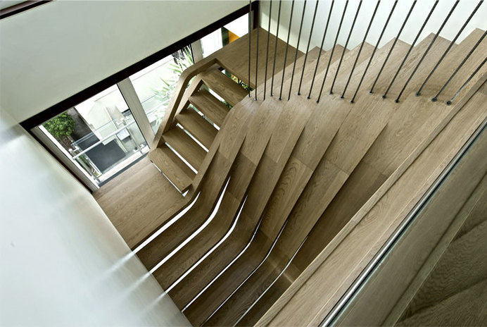 Sophisticated Indian Apartment with Woven Staircase central focal art point wooden staircase 1 #stairs #interior #staircase #design