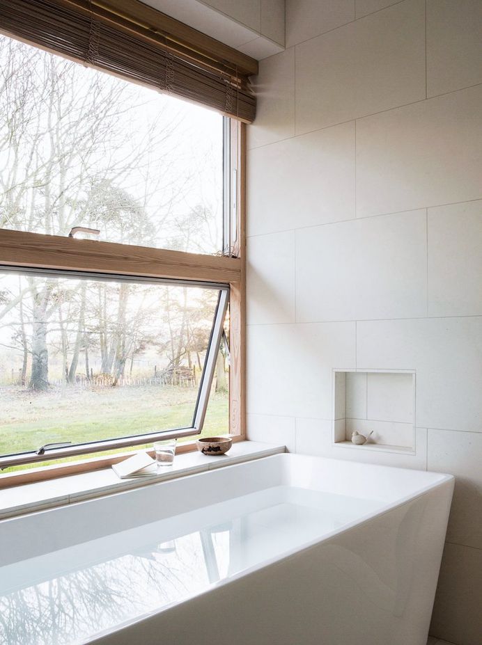 Bathtub by window. Reydon Grove Farm by Norm Architects. © Jonas Bjerre-Poulsen. #bathroom