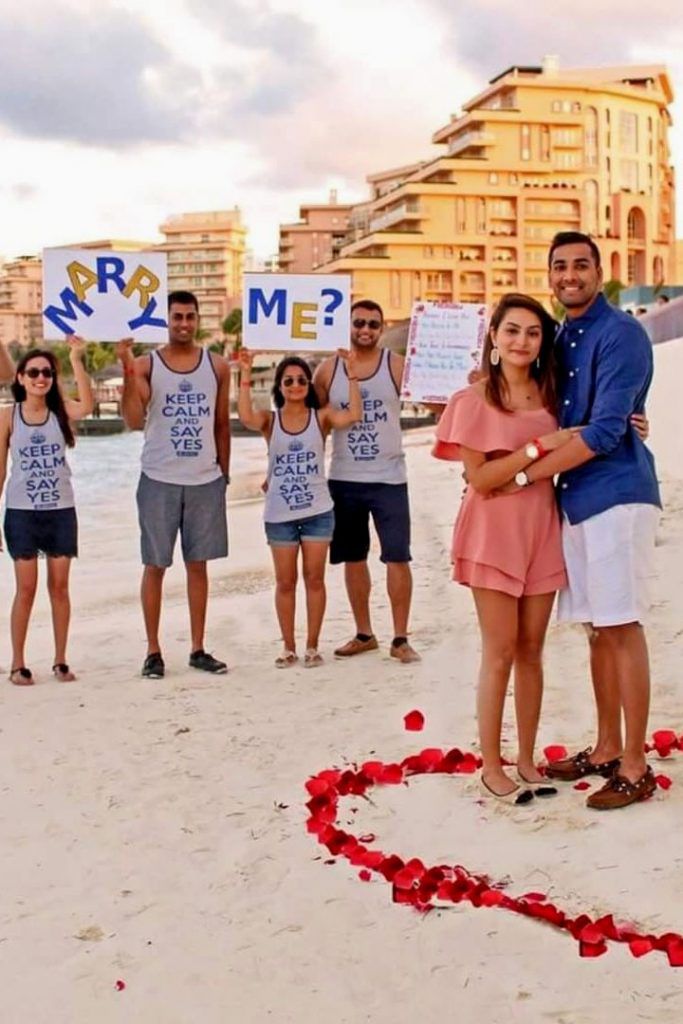 beach proposals engagement with friends help