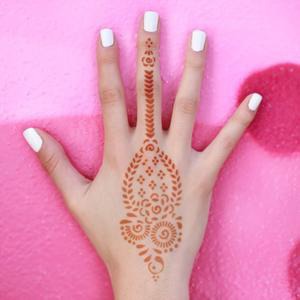 Marah - back of hand henna tattoo This unique henna tattoo combines traditional designs with a modern take. Place Marah on the back of your hand, and it will create a ring design too. Shop Mihenna!