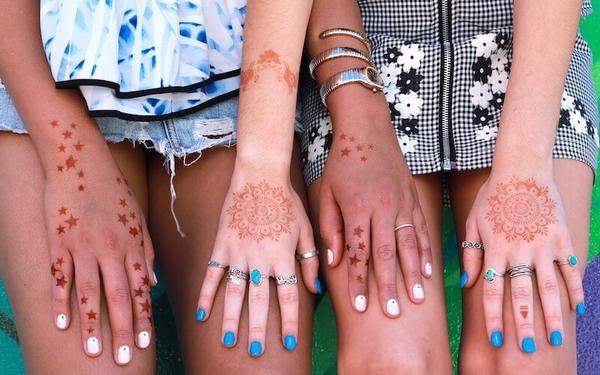 Two Women with Matching Henna Tattoos on Back of Hands New summer 2020 henna stencils are ready for you at Mihenna! Beginners will love these easy henna tattoos in a variety of styles from traditional to modern.