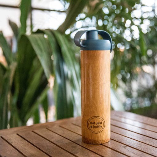 Bamboo Bottle End the use of plastic bottles with this Sustainable Bamboo Water Bottle. Durable, reusable and eco-friendly, each bottle features a unique color and finish and comes with a silicone lid. They are carefully handmade by makers and families from local villages throughout Vietnam. The sustainably-sourced bamboo is food safe, and heat resistant.