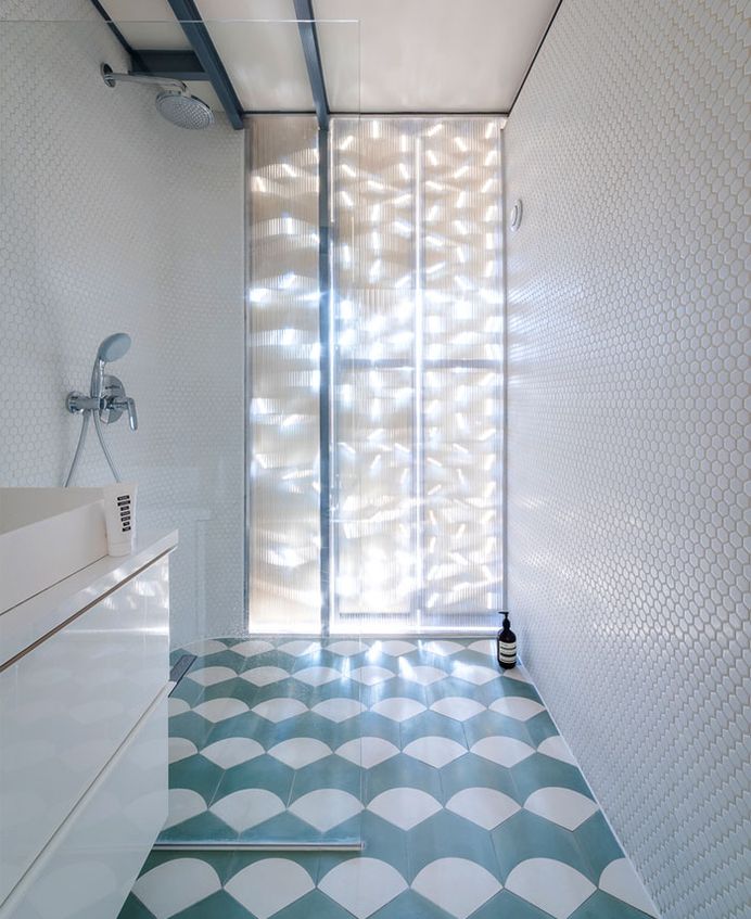 Perforated Aluminum Island at Parisian Apartment by SABO Project - InteriorZine