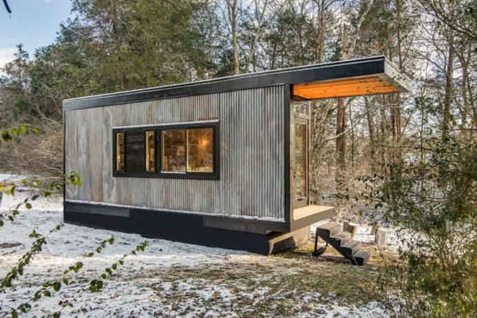 Reclaimed Wood Writer's Studio - IPPINKA New Frontier Tiny Homes has created The Cornelia, inspired by renowned children's author Cornelia Funke. This idyllic cabin is just 24 feet in length and 8.5 feet wide. It is versatile, the three-in-one space can be utilized as a writing studio, guest house and a library.
