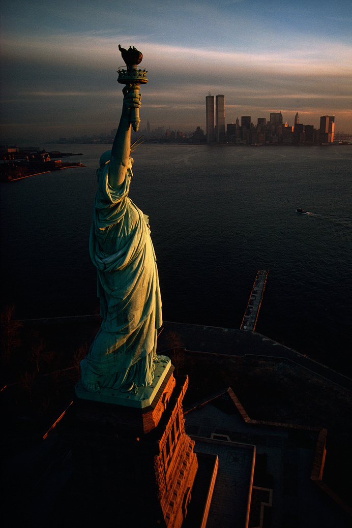 The Statue of Liberty hails dawn over New York Harbor in 1978.Photograph by David Alan Harvey, National Geographic Creative #statue #of #liberty