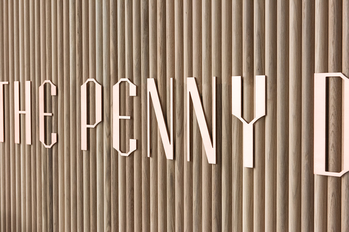 the penny drop cafe by pop and pac melbourne australia beautiful interior design branding logotype copper wood graphic modern coffee inspira