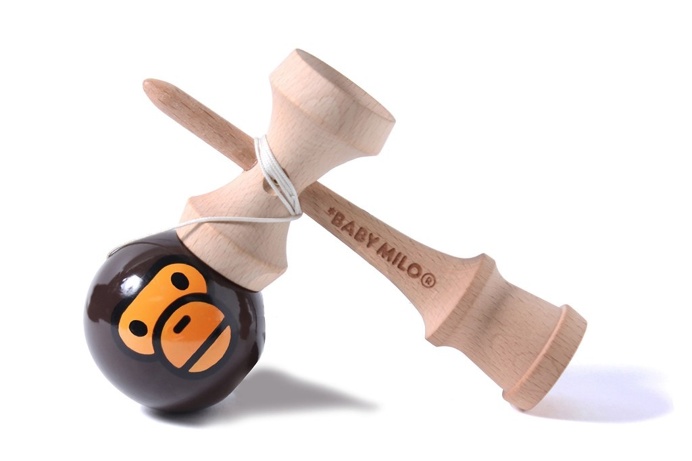 kendama — a traditional Japanese toy made of wood that resembles a cup-and-ball game. bape baby milo
