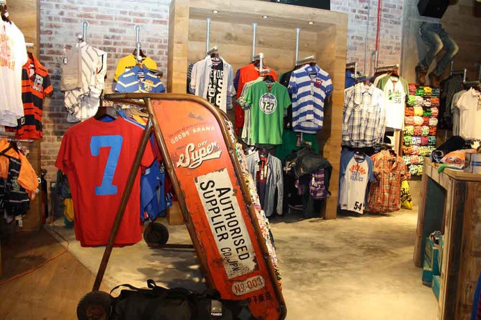 Here you see some of the gondola displays hanging the garments of clothing for sale.