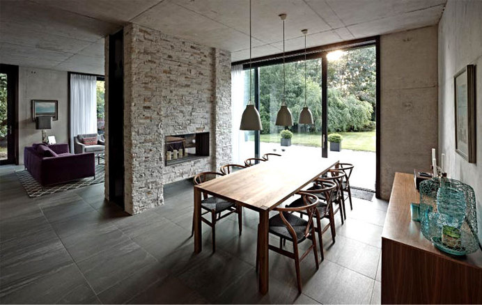 Suburban Home with Concrete Structure that is Exposed Throughout the Interior building concrete structure exposed interior #interior #dining #design #area #table
