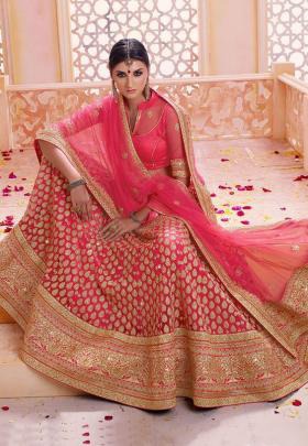 Pink heavy bridal lehenga with neckline blouse and net dupatta
