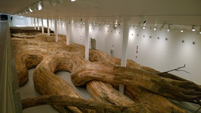 Henrique Oliveira Constructs a Cavernous Network of Repurposed Wood Tunnels at MAC USP #wood #installation
