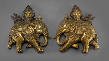 Pair of fine fire-gilded repoussé technology-models of caparisoned elephants