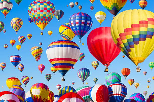 Hot air balloons floating in blue sky