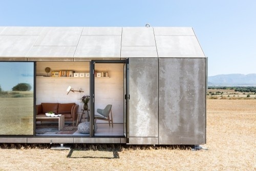 Portable House ÁPH80 is a minimalist house located in Spain, designed by Ábaton Arquitectura. The outside is covered with grey cement wood #house #small