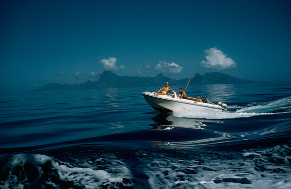 A motorboat carries tourists to fishing grounds off Tahiti, July 1962.Photograph by Luis Marden, National Geographic #photography #vintage #boat #film