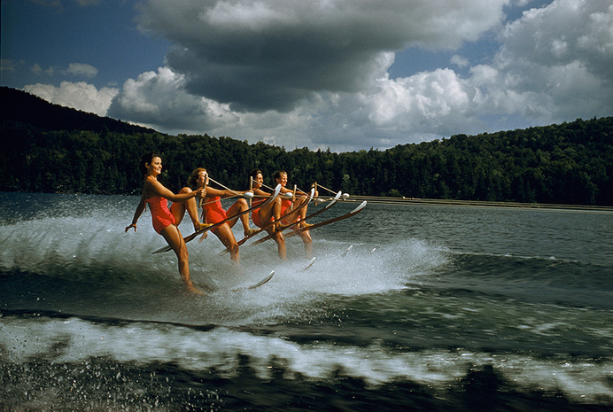 A womens water ski team lifts skis while being towed at 23 mph on Darts Lake in New York, 1956.Photograph by Robert Sisson, National Geogra #skiing #national #water #geographic