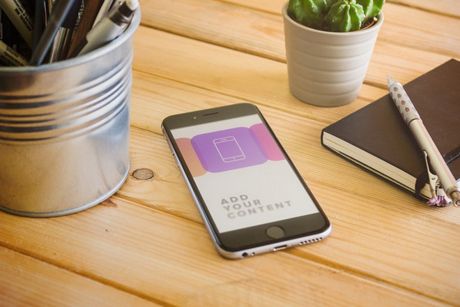 Free Realistic iPhone 6 Mockup on Wooden Table