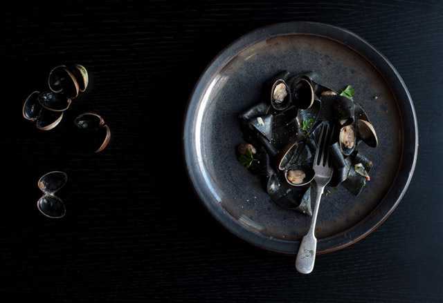 Squid ink pasta with clams and white wine