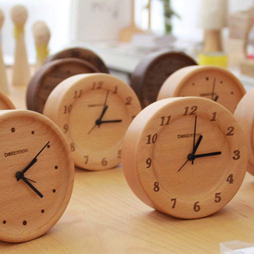 Beech Wood Table Clock These Beech Wood Table Clocks are stylish and modern alarm clocks great for office and bedroom use. They are made out of 100% German beech wood and have a subtle fragrance. The clocks are hand carved with natural wood wax oil and have no coverings on the dial plate.