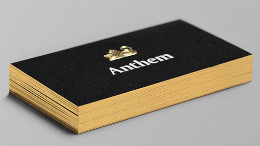 Gold Foil Embossed Logo On A Black Business Card