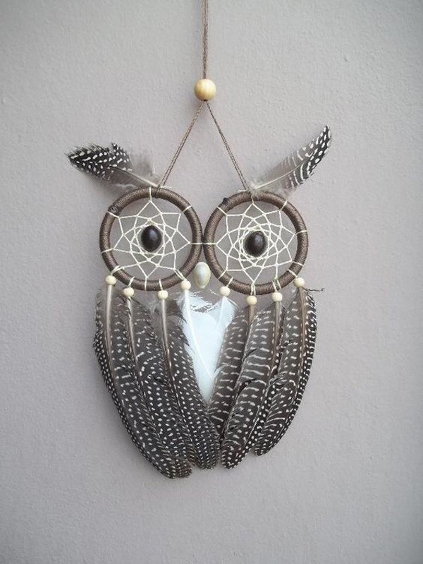 Here's a cute owl-inspired dream catcher with the use of two loops, beads and different feathers.