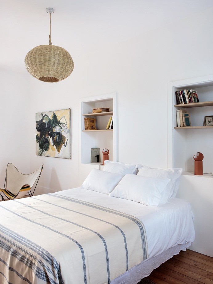 One of the four bedrooms in the main house (there are also three bedrooms in the annex). The wicker lights are from a Moroccan import store in Paris.