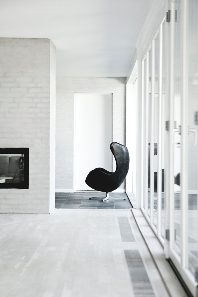 Living area with fireplace. Bang House by Norm.Architects. #normarchitects #livingroom #fireplace #egg
