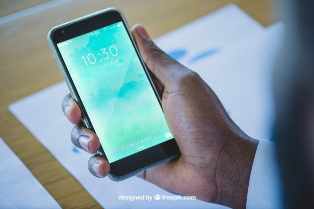 Hand holding smartphone in office Free Psd. See more inspiration related to Mockup, Business, Technology, Hand, Phone, Office, Mobile, Presentation, Smartphone, Elegant, Present, Mock up, Success, Modern, Mobile phone, Display, Screen, Holding hands, Up, Successful, Holding, Mock and Presenting on Freepik.