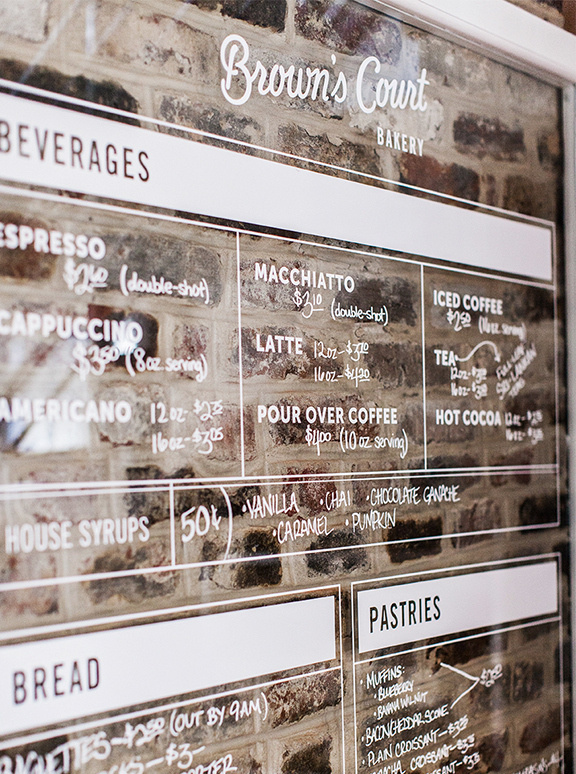Nudge Studio Â | Â Â http://studionudge.com"Situated in an 1800s Charleston style home, Browns Court Bakery is the only remaining structu #brick #lettering #white #board #notice