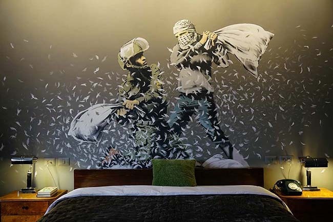 Banksy opens hotel in Bethlehem, and it has the 'Worst View In The World' #banksyhotel #banksy #TheWalledOff #Bethlehem #Palestine #wes