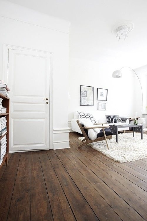 White living room with wooden floor. #livingroom #minimalist