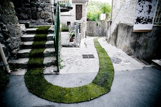 grass carpet winds through a french village, gaëlle villedary, photograph, https://www.designboom.com/art/grass-carpet-winds-through-a-fre