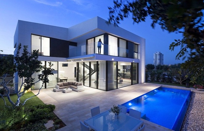 L-Shaped Home Organized Around a Central Steel Staircase 18