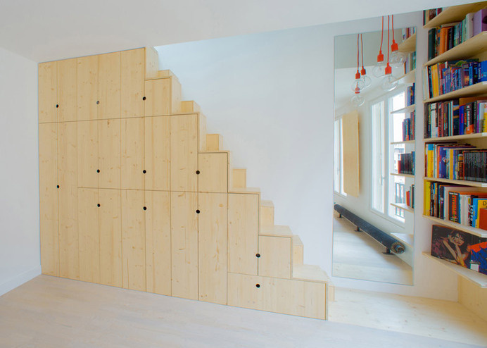 Apartment in Paris by Schemaa features a staircase made of cupboards #interior