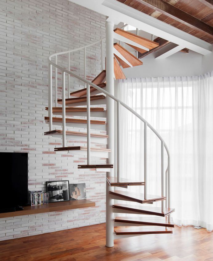 Compact Mezzanine Apartment with Spiral Staircase - InteriorZine
