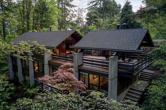 Modern Chalet. In 1979, a roof structure that mirrors the roofline on the home was designed by architect Gary Michael to cover a section of the large ipe deck.